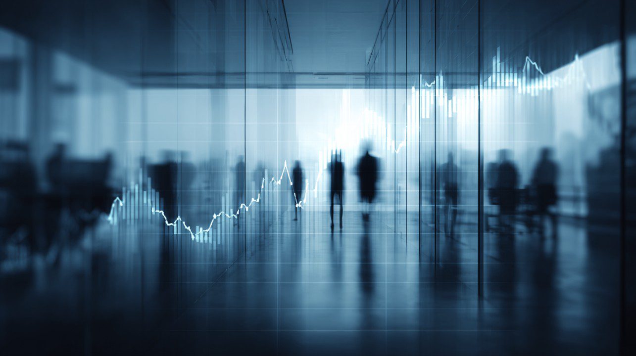 Blurred silhouettes in a modern office with an abstract rising stock market chart overlay.