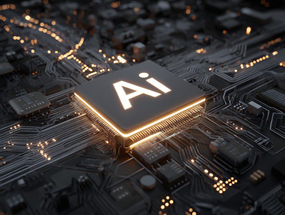 Close-up image of an AI processor chip surrounded by glowing gold circuits on a sleek black motherboard.