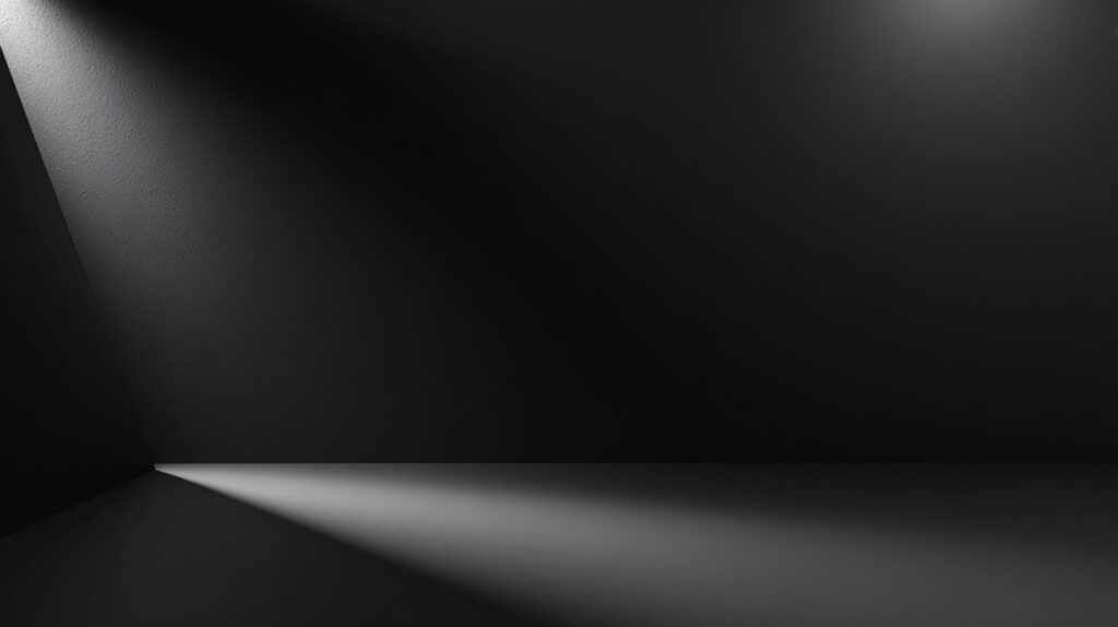 Matte black minimalist PowerPoint background with angled spotlight creating dramatic shadows and sleek modern look.