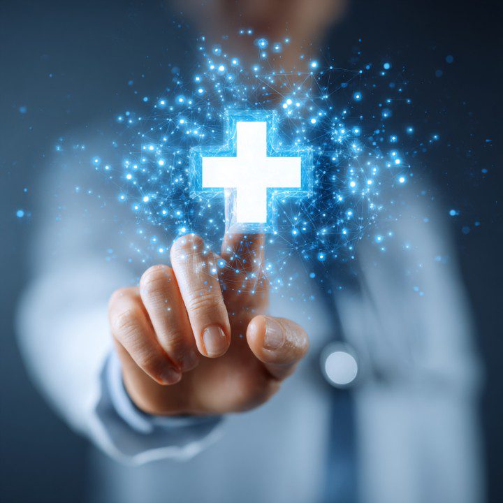 Medical worker with a stethoscope touching a glowing plus icon symbolizing healthcare technology and innovation.