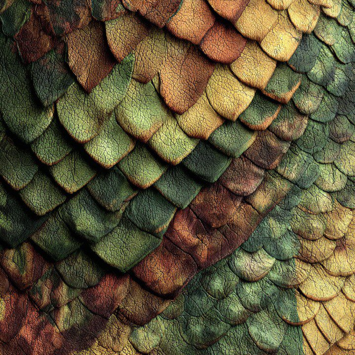 Close-up of reptile skin texture with green, brown, and yellow scales in a seamless pattern.