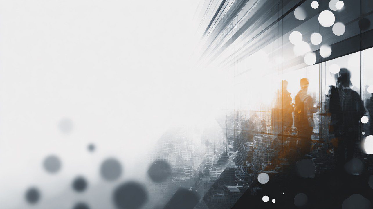 Silhouetted business professionals near glass with city reflections and bright bokeh lights, symbolizing teamwork and modern business.