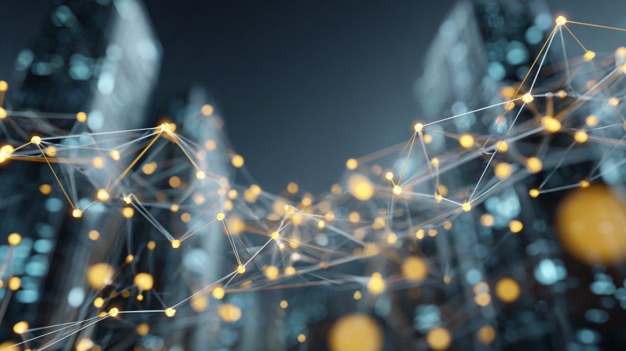 Futuristic 3D digital mesh of glowing golden nodes connected above a smart cityscape, symbolizing tech and data systems.