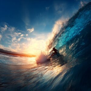 Surfer skillfully rides through a curling barrel wave during a dramatic ocean sunset, creating a stunning action shot.