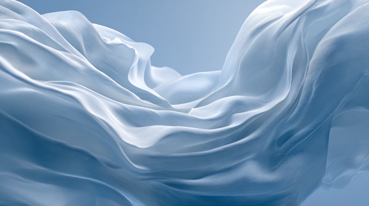 Hyperrealistic macro image of soft, flowing translucent fabric in blue tones, ideal for abstract, elegant, and serene backgrounds.
