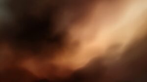 Abstract soft-focus gradient with dark brown and cream tones, creating a dreamy and cinematic visual background.