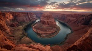 Dramatic sunset over Horseshoe Bend with glowing red canyon cliffs and a winding river in Arizona’s desert landscape.